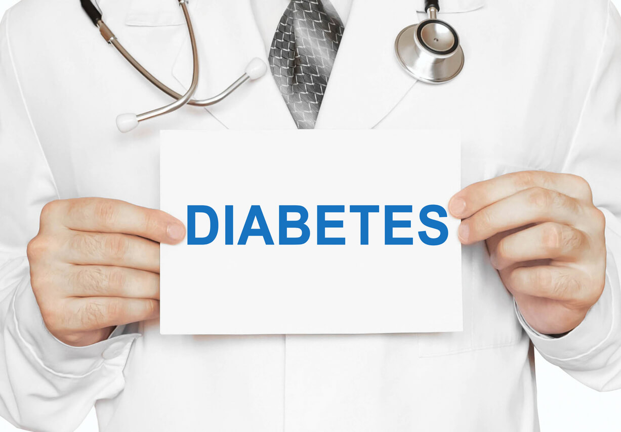 Doctor holding a card with Diabetes
