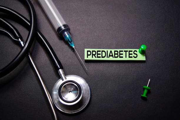 Prediabetes text on Sticky Notes. Top view isolated on black background. Healthcare/Medical concept